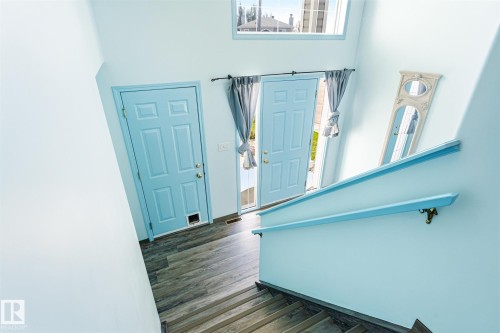 Entryway with two paneled doors, one featuring a pet door - 14908 137 Street, Edmonton, AB 