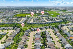 Aerial perspective showcasing a residential neighborhood with extensive green spaces and established streetscapes - 