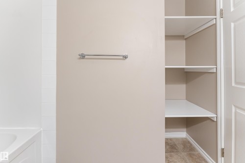 Built-in shelving unit providing organized storage - 16B Callingwood Court, Edmonton, AB 