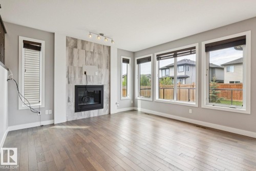 2545 Amerongen Crescent, Edmonton, AB - Indoor Photo Showing Living Room With Fireplace