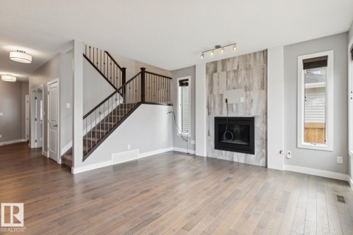 2545 Amerongen Crescent, Edmonton, AB - Indoor Photo Showing Other Room With Fireplace