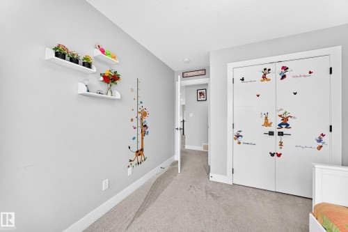 Interior room with light gray walls and white trim - 8710 Mayday Lane, Edmonton, AB 