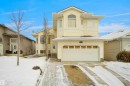 Two-story residence featuring light-colored siding and a gabled roofline - 4816 155 Ave, Edmonton, AB 