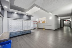 South entryway featuring wall-mounted mailboxes - 