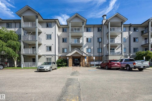 South building entrance, featuring light-toned siding. - 201 3425 19 Street Nw, Edmonton, AB 