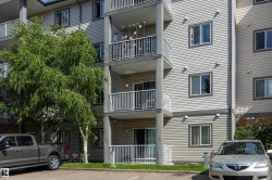 South-facing private balconies, exterior featuring light, table and chair. - 