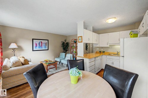 Open-concept living space with wood-finish flooring - 19 Pineview Drive, St. Albert, AB 