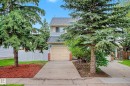 Two-story siding exterior with an attached garage and a concrete driveway - 19 Pineview Drive, St. Albert, AB 