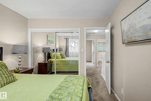 Bedroom featuring neutral-toned walls and plush carpeting - 19 Pineview Drive, St. Albert, AB 