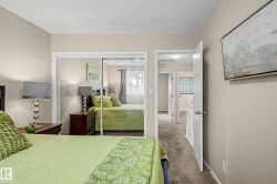 Bedroom featuring neutral-toned walls and plush carpeting - 