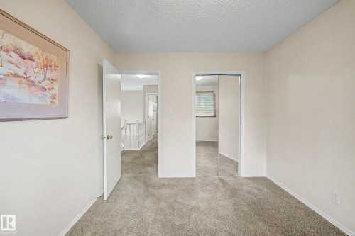 Carpeted room with neutral wall color - 19 Pineview Drive, St. Albert, AB 