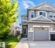 Contemporary gray siding exterior with white trim accents - 5407 14 Avenue, Edmonton, AB 