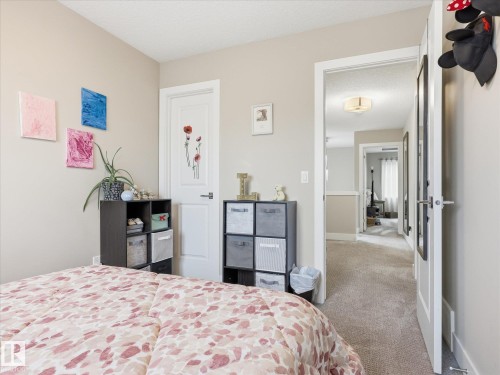 Bedroom featuring neutral-toned walls and carpet flooring - 12820 68 Street, Edmonton, AB - Indoor Photo Showing Bedroom