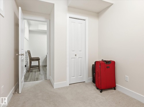 Neutral-toned room with plush carpet flooring and white baseboards - 12820 68 Street, Edmonton, AB - Indoor