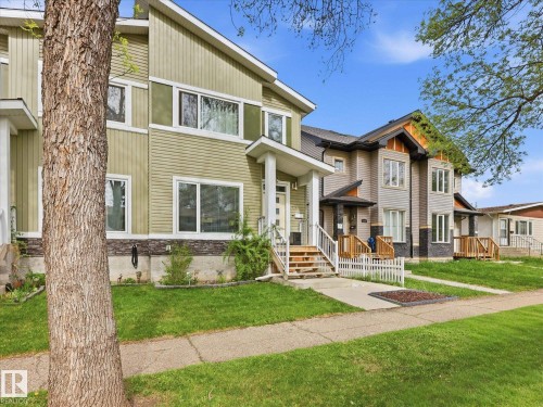 Modern exterior featuring light green siding and white trim - 12820 68 Street, Edmonton, AB - Outdoor With Facade