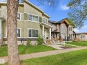 Modern exterior featuring light green siding and white trim - 12820 68 Street, Edmonton, AB  - Outdoor With Facade 