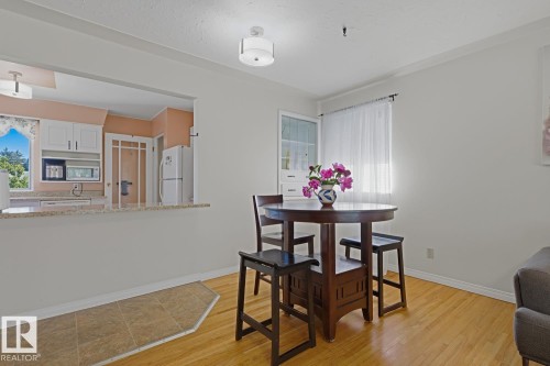 Bright dining area featuring hardwood flooring - 15707 92 Avenue, Edmonton, AB 