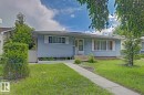 Light blue siding exterior featuring white trim and shutters - 15707 92 Avenue, Edmonton, AB 