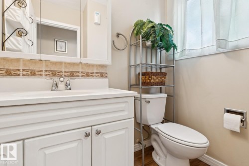 White vanity with chrome fixtures and an integrated sink - 3015 131 Avenue, Edmonton, AB 