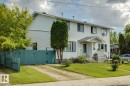 Two-story duplex with white siding exterior - 3015 131 Avenue, Edmonton, AB 