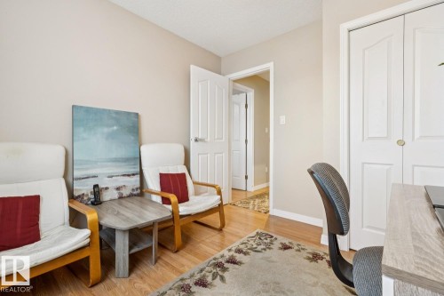 This room features light-toned walls, wood-finish flooring, and white trim - 3015 131 Avenue, Edmonton, AB 
