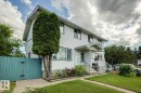 Two-story property featuring white siding and dark trim - 3015 131 Avenue, Edmonton, AB 