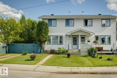 Two-story property featuring white siding and a dark gray shingle roof - 3015 131 Avenue, Edmonton, AB 