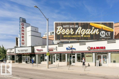 Art Deco-inspired commercial building featuring a prominent vertical marquee - 216 11503 76 Avenue, Edmonton, AB 