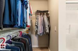 Closet space featuring wire shelving and hanging rods - 