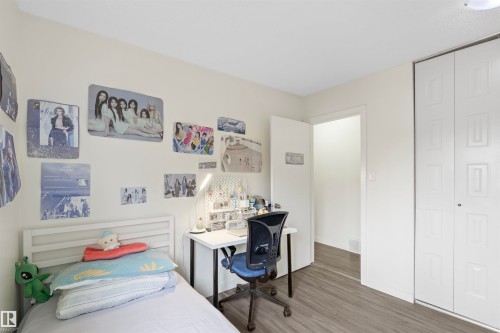 Light-colored walls complement the wood-finish flooring - 173 Tudor Lane, Edmonton, AB 
