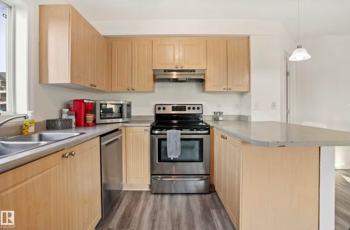 #217 630 Mcallister Lo Sw, Edmonton, AB - Indoor Photo Showing Kitchen With Double Sink