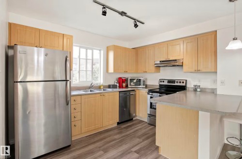 #217 630 Mcallister Lo Sw, Edmonton, AB - Indoor Photo Showing Kitchen With Double Sink