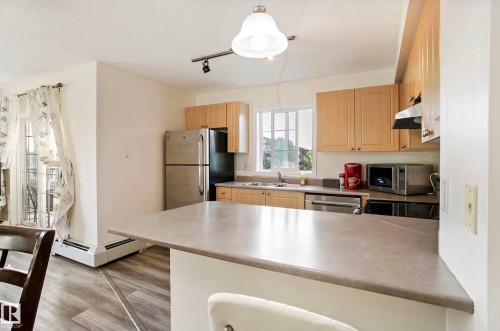 #217 630 Mcallister Lo Sw, Edmonton, AB - Indoor Photo Showing Kitchen With Double Sink