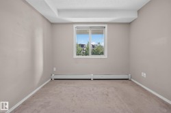 Neutral-toned walls complement the window with horizontal blinds - 