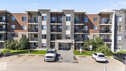 Modern multi-story building featuring stone veneer and horizontal siding - 