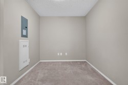 Carpeted room with neutral wall color and white baseboards - 
