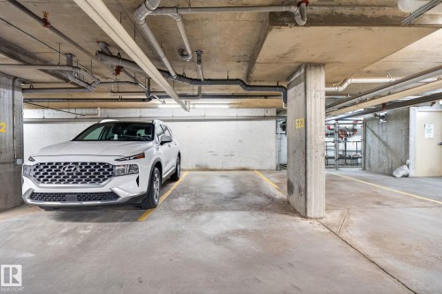 Designated parking space within a concrete subterranean garage - 205 11816 22 Avenue, Edmonton, AB 