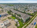 Multi-unit residential complex featuring a gabled roofline and multiple balconies - 233 3425 19 Street, Edmonton, AB 