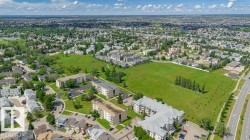 Aerial perspective showcasing a residential area with diverse property types - 