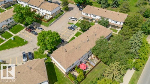 Townhome community featuring private patios, mature trees, and individual parking spaces - 24 14511 52 Street, Edmonton, AB 