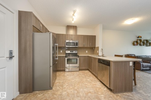 120 1820 Rutherford Road, Edmonton, AB - Indoor Photo Showing Kitchen With Stainless Steel Kitchen