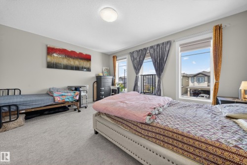 Neutral-toned walls complement the light grey carpeted flooring - 1927 18 Street, Edmonton, AB 