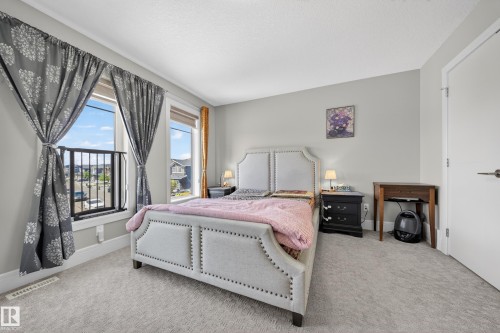 Carpeted room with light gray walls and white trim - 1927 18 Street, Edmonton, AB 