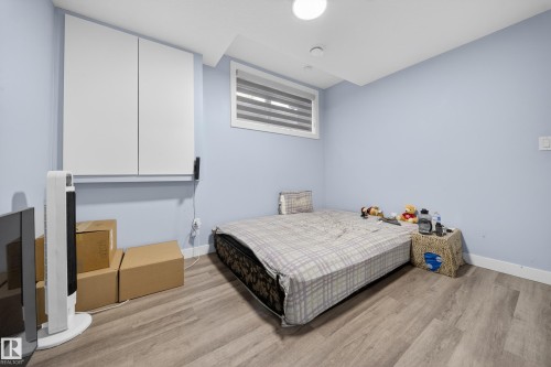 Light blue painted walls with wood-finish flooring - 1927 18 Street, Edmonton, AB 