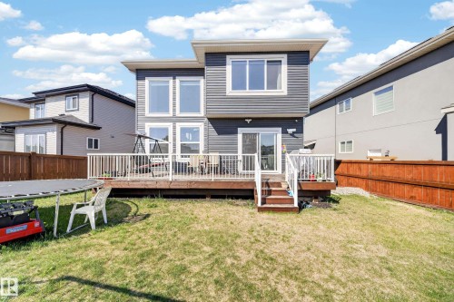 Two-story exterior featuring dark gray siding and white trim - 1927 18 Street, Edmonton, AB 