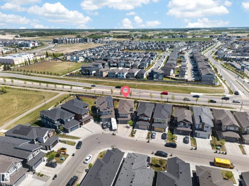 Aerial view of a residential neighborhood with numerous detached homes featuring dark-toned roofs - 1927 18 Street, Edmonton, AB 
