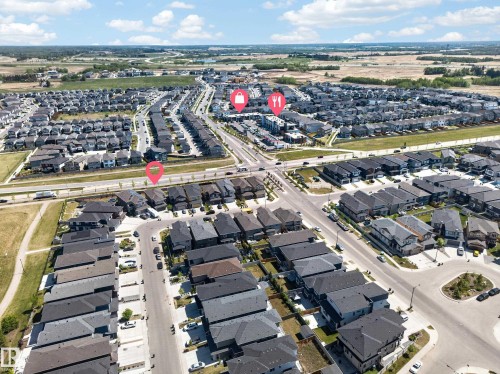 Aerial depiction of a residential community featuring numerous detached homes with dark-toned roofs - 1927 18 Street, Edmonton, AB 