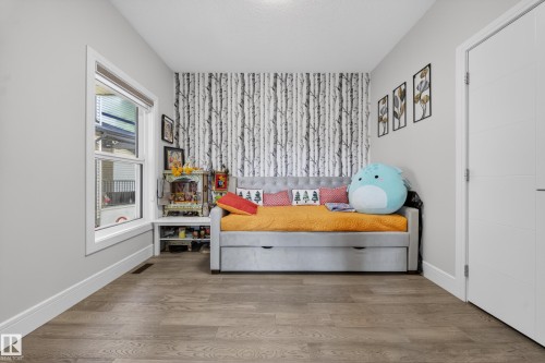 Interior room featuring wood-finish flooring and light gray walls - 1927 18 Street, Edmonton, AB 