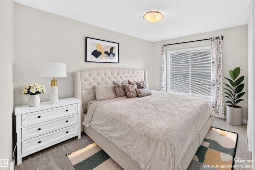 Bedroom featuring light-colored walls and carpet flooring - 118 655 Watt Boulevard Sw, Edmonton, AB 