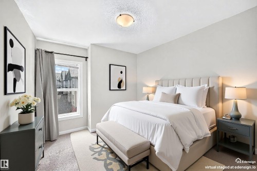 Bedroom featuring light gray walls, a single window with a dark curtain rod, and a semi-flush mount ceiling light fixture - 118 655 Watt Boulevard Sw, Edmonton, AB 